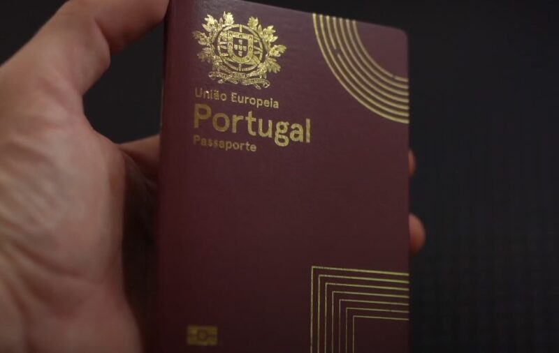 Hand holding Portuguese passport