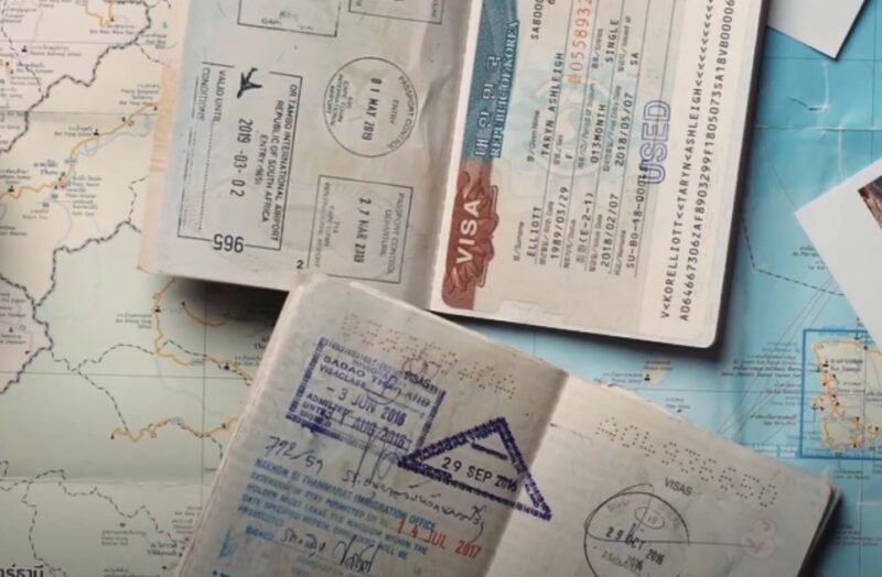 Open Portuguese passport on a map table